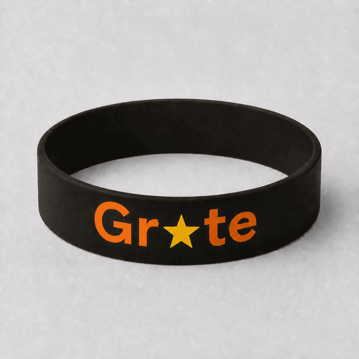 Official warm obsidian Grate band with the orange Grate wordmark and golden star